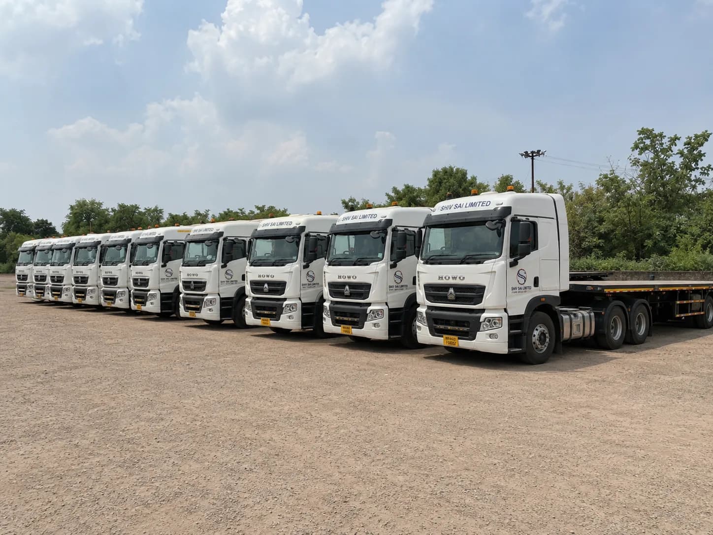 Shiv Sai Limited tipper trucks in convoy on a construction haul route