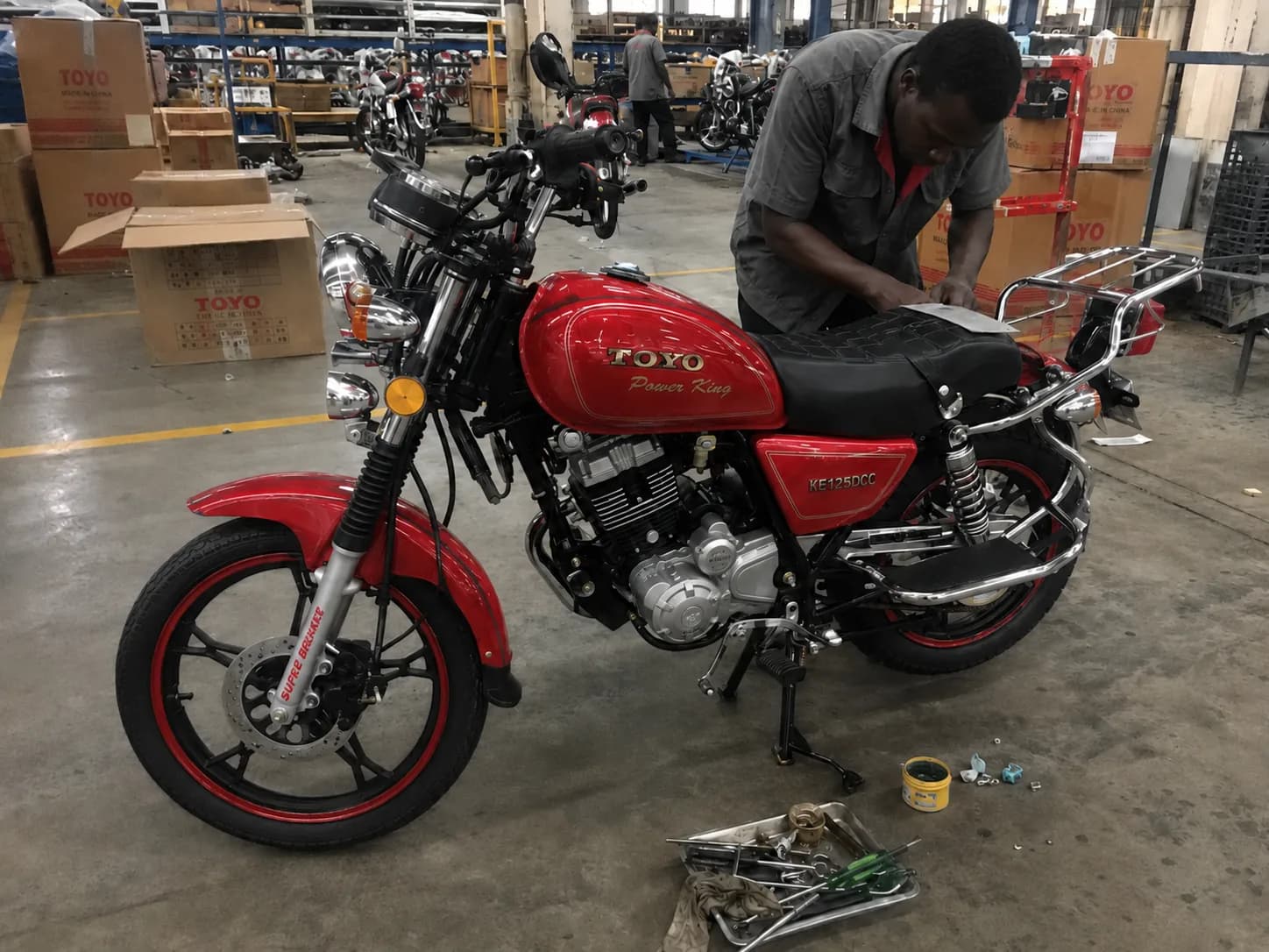 TOYO motorcycle assembly and quality checks before distribution to dealers